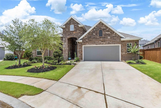 1703 Rosings Way, Katy, TX 77493 - traditional-style home with an attached garage, driveway, and brick siding