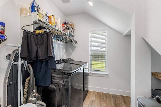 1703 Rosings Way, Katy, TX 77493 - washroom featuring washing machine and dryer and wood finished floors