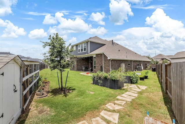 1703 Rosings Way, Katy, TX 77493 - fenced backyard featuring a vegetable garden