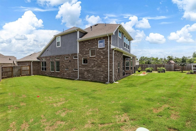1703 Rosings Way, Katy, TX 77493 - rear view of property featuring a fenced backyard and brick siding