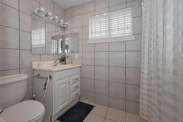 7230 Redding Rd, Houston, TX 77036 - full bath with tile walls, vanity, tile patterned flooring, and curtained shower
