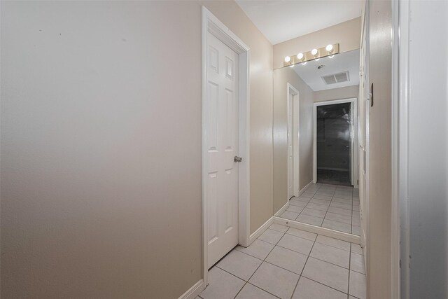 7230 Redding Rd, Houston, TX 77036 - hall featuring light tile patterned floors and baseboards