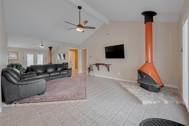 7230 Redding Rd, Houston, TX 77036 - living area with a wood stove, a ceiling fan, light tile patterned floors, beam ceiling, and high vaulted ceiling