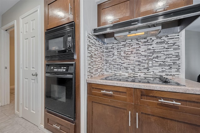 7230 Redding Rd, Houston, TX 77036 - kitchen featuring black appliances, ventilation hood, decorative backsplash, and light countertops