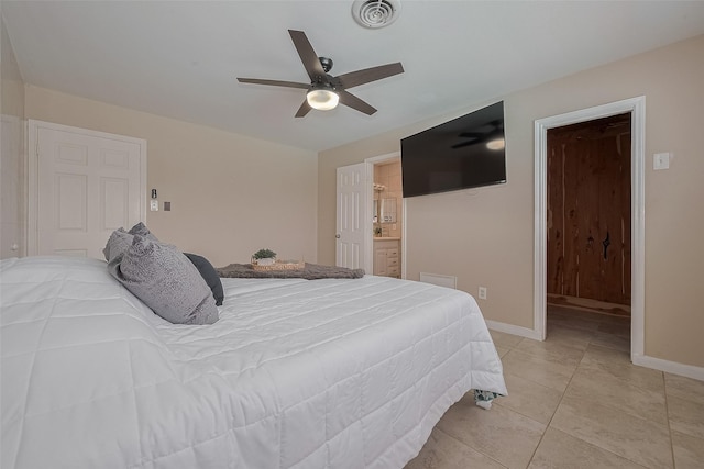 7230 Redding Rd, Houston, TX 77036 - bedroom with light tile patterned floors, ceiling fan, and connected bathroom