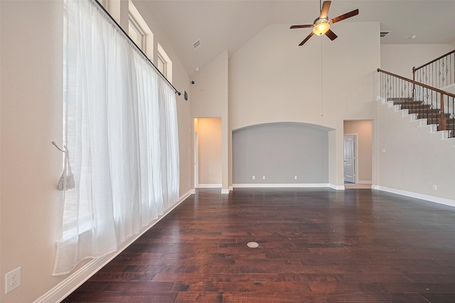 310 Blossom Terrace Ln, Rosenberg, TX 77469 - unfurnished living room featuring a ceiling fan, high vaulted ceiling, stairway, and wood finished floors