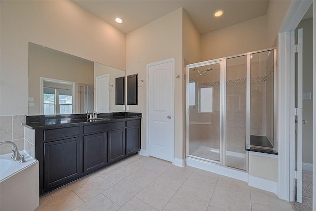 310 Blossom Terrace Ln, Rosenberg, TX 77469 - bathroom featuring a stall shower, vanity, a garden tub, tile patterned flooring, and recessed lighting