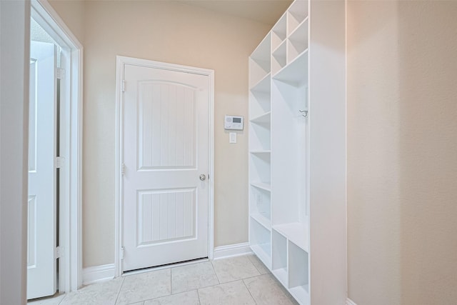 310 Blossom Terrace Ln, Rosenberg, TX 77469 - mudroom with light tile patterned flooring and baseboards