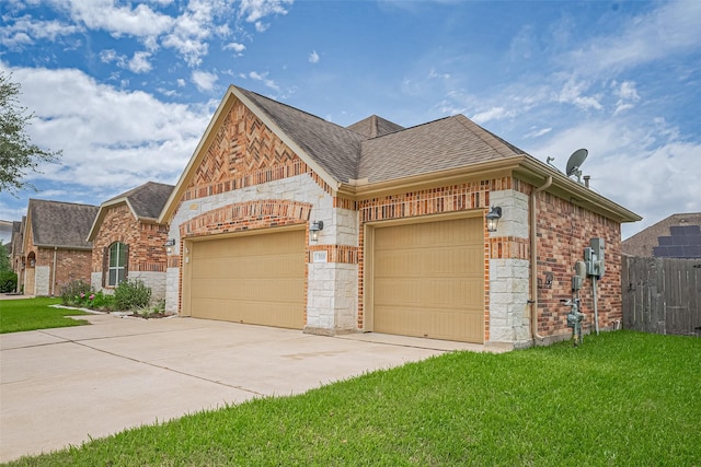 310 Blossom Terrace Ln, Rosenberg, TX 77469 - french country style house featuring a shingled roof, a garage, concrete driveway, and stone siding
