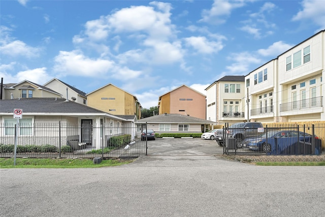 4401 Marina St Unit B, Houston, TX 77007 - view of asphalt driveway featuring a residential view and a gated entry