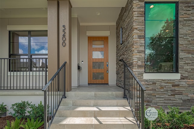 5200 Beech St, Bellaire, TX 77401 - property entrance featuring stone siding and covered porch