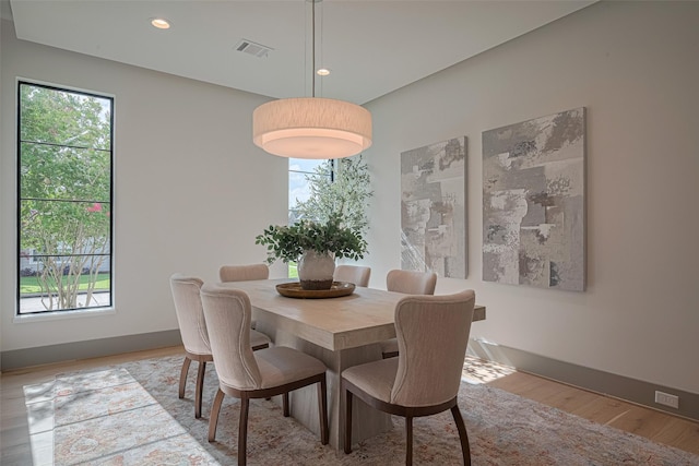 5200 Beech St, Bellaire, TX 77401 - dining space featuring plenty of natural light, light wood-type flooring, and recessed lighting