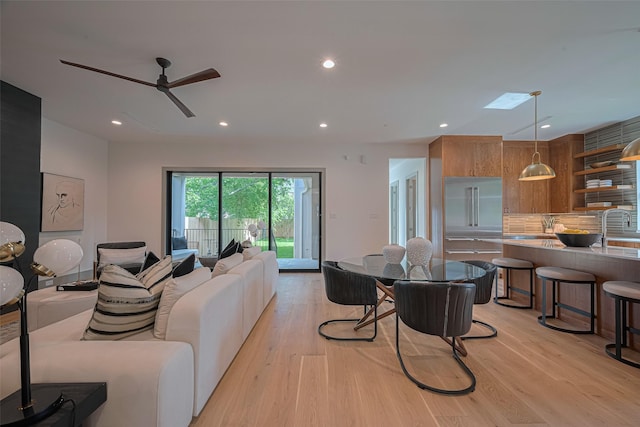 5200 Beech St, Bellaire, TX 77401 - living room with light wood-type flooring, recessed lighting, and ceiling fan