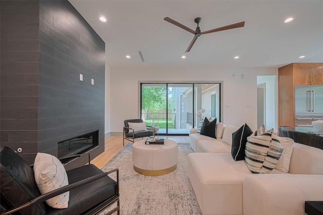5200 Beech St, Bellaire, TX 77401 - living room with recessed lighting, ceiling fan, light wood-type flooring, and a large fireplace