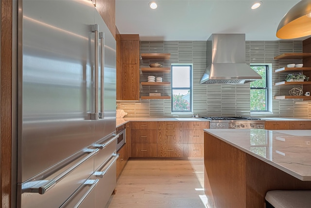 5200 Beech St, Bellaire, TX 77401 - kitchen featuring appliances with stainless steel finishes, exhaust hood, open shelves, light wood-style floors, and recessed lighting