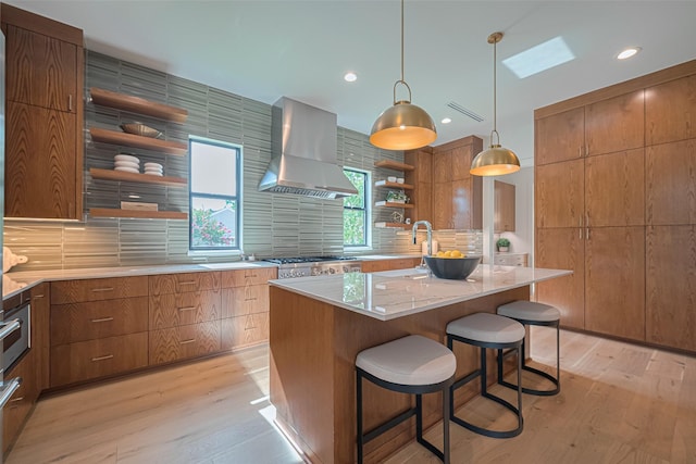 5200 Beech St, Bellaire, TX 77401 - kitchen with open shelves, wall chimney exhaust hood, backsplash, light wood-style floors, and light countertops