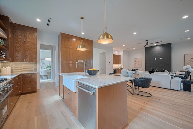5200 Beech St, Bellaire, TX 77401 - kitchen with appliances with stainless steel finishes, open shelves, modern cabinets, light wood-style flooring, and recessed lighting