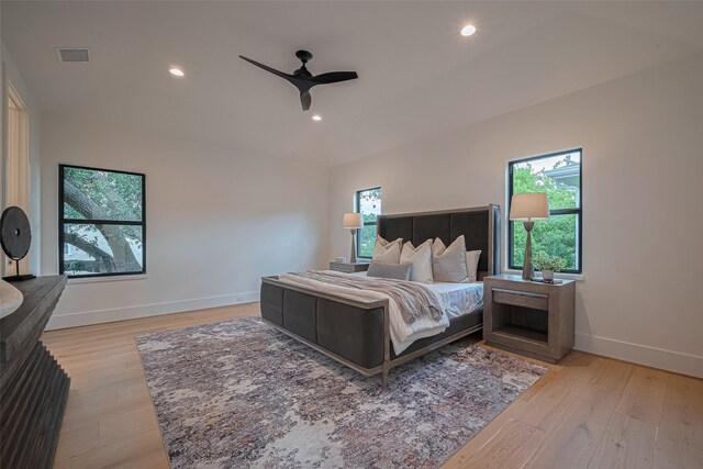 5200 Beech St, Bellaire, TX 77401 - bedroom featuring multiple windows, light wood-style floors, recessed lighting, and ceiling fan