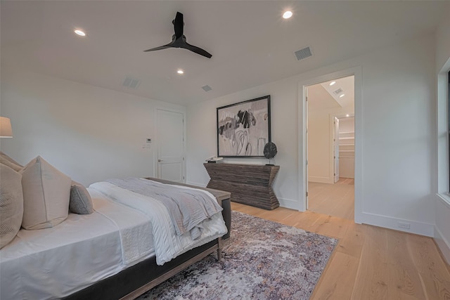 5200 Beech St, Bellaire, TX 77401 - bedroom featuring recessed lighting, light wood finished floors, and a ceiling fan