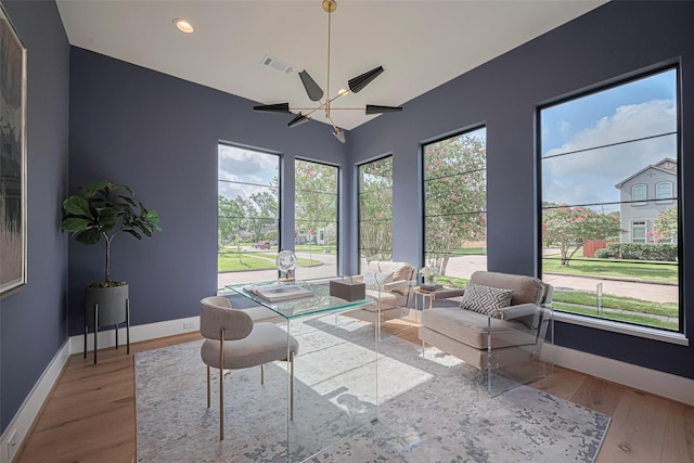 5200 Beech St, Bellaire, TX 77401 - sunroom / solarium featuring wood finished floors and recessed lighting