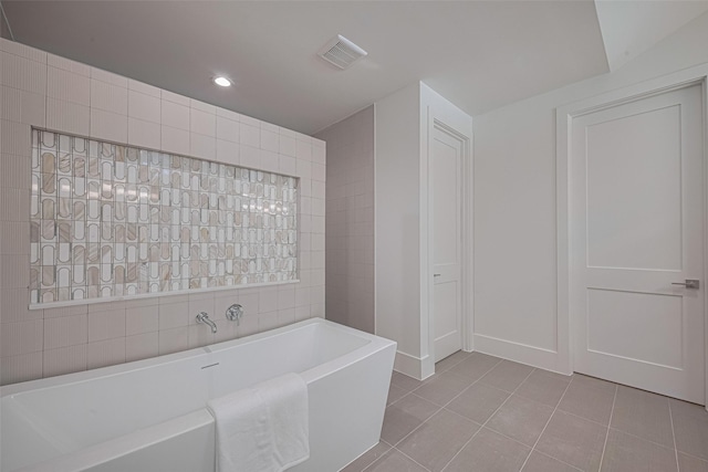 5200 Beech St, Bellaire, TX 77401 - full bathroom featuring a freestanding bath, tile patterned floors, and recessed lighting