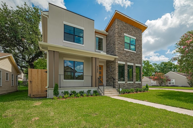 5200 Beech St, Bellaire, TX 77401 - modern home with stone siding, stucco siding, a front lawn, and a porch