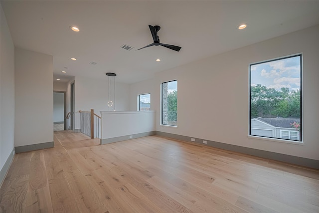 5200 Beech St, Bellaire, TX 77401 - empty room featuring light wood-type flooring, a ceiling fan, and recessed lighting