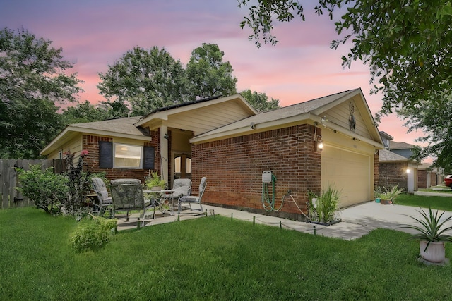 9731 Gulfstream Dr, Conroe, TX 77303 - back of house featuring brick siding, an attached garage, and driveway