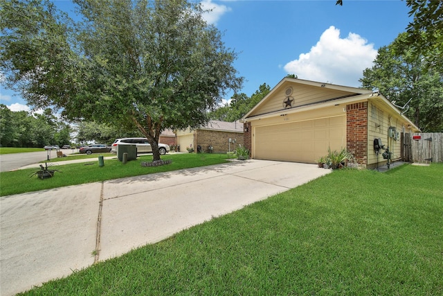 9731 Gulfstream Dr, Conroe, TX 77303 - view of property exterior featuring driveway, a lawn, an attached garage, and brick siding