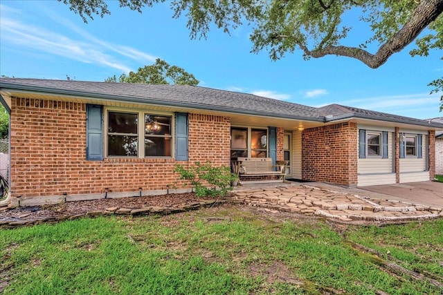 1403 Newport Blvd, League City, TX 77573 - single story home featuring brick siding, covered porch, and a patio
