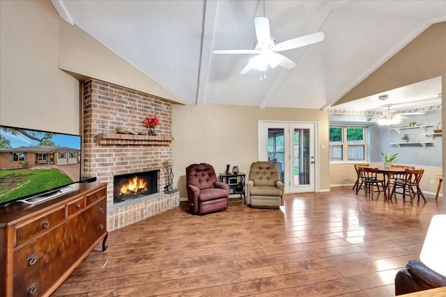 1403 Newport Blvd, League City, TX 77573 - sitting room with lofted ceiling, ceiling fan, wood finished floors, and a fireplace