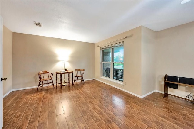 1403 Newport Blvd, League City, TX 77573 - sitting room featuring wood finished floors and baseboards