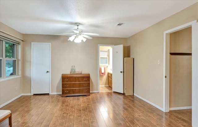 1403 Newport Blvd, League City, TX 77573 - bedroom with light wood-style floors, ensuite bathroom, and ceiling fan