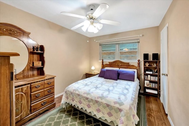 1403 Newport Blvd, League City, TX 77573 - bedroom with dark wood-style floors and a ceiling fan