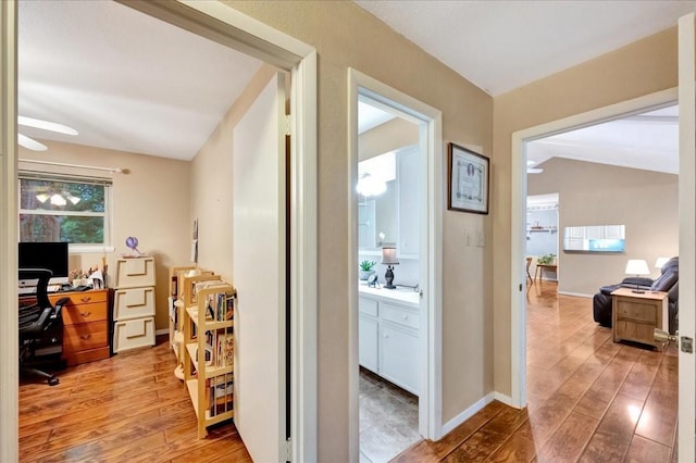 1403 Newport Blvd, League City, TX 77573 - hall featuring light wood-style flooring, a desk, and vaulted ceiling