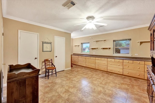1403 Newport Blvd, League City, TX 77573 - kitchen with open shelves, a ceiling fan, dark countertops, ornamental molding, and light brown cabinetry