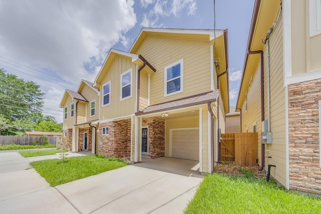 2142 De Soto St, Houston, TX 77091 - multi unit property with an attached garage, concrete driveway, stone siding, and board and batten siding