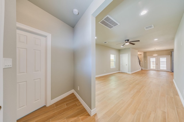 2142 De Soto St, Houston, TX 77091 - empty room with light wood finished floors, a smoke detector, plenty of natural light, ceiling fan, and recessed lighting