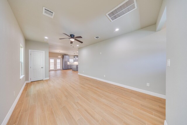 2142 De Soto St, Houston, TX 77091 - unfurnished living room featuring light wood finished floors, ceiling fan, and recessed lighting