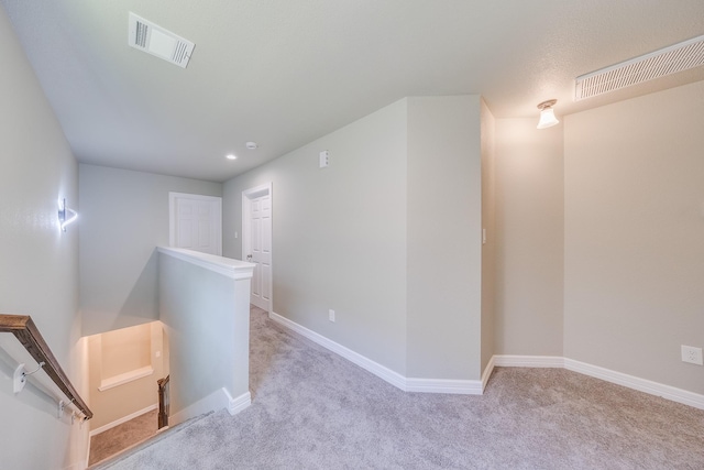 2142 De Soto St, Houston, TX 77091 - hall with an upstairs landing, carpet floors, and recessed lighting