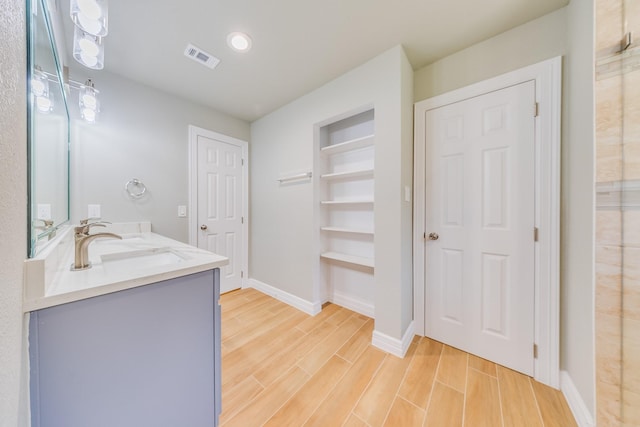 2142 De Soto St, Houston, TX 77091 - bathroom with double vanity, wood finished floors, and built in features