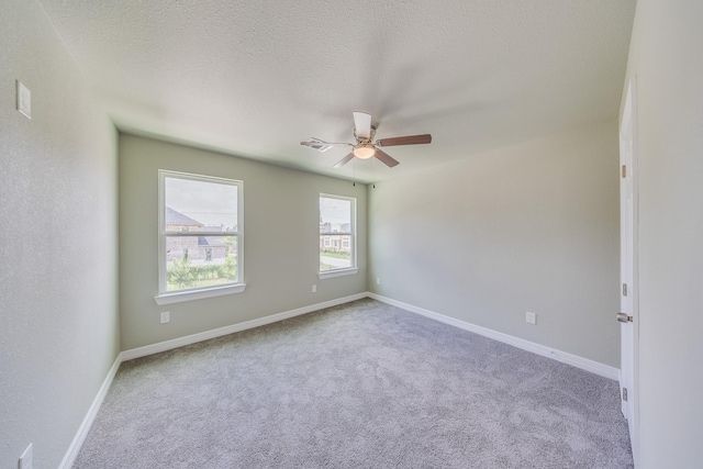 2142 De Soto St, Houston, TX 77091 - spare room featuring ceiling fan, carpet, and a textured ceiling
