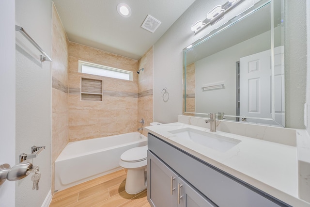 2142 De Soto St, Houston, TX 77091 - bathroom featuring vanity, shower / bathtub combination, and wood finished floors