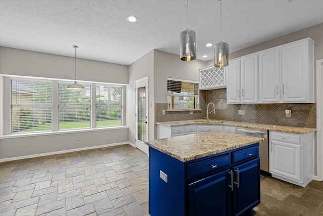 2625 Seashore Dr, Seabrook, TX 77586 - kitchen with blue cabinetry, stone tile flooring, white cabinetry, a textured ceiling, and recessed lighting