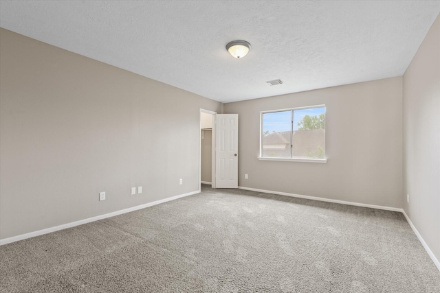 2625 Seashore Dr, Seabrook, TX 77586 - carpeted spare room with baseboards and a textured ceiling