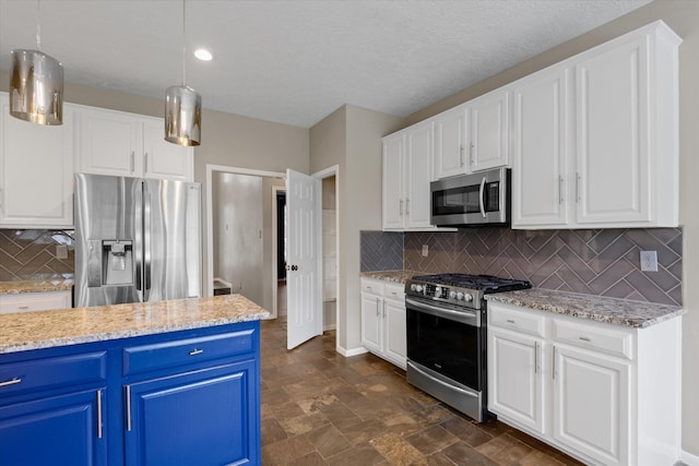 2625 Seashore Dr, Seabrook, TX 77586 - kitchen featuring stainless steel appliances, blue cabinets, and white cabinetry