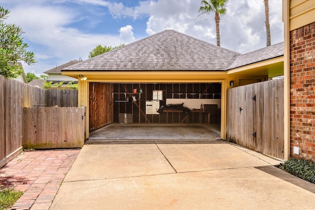 2625 Seashore Dr, Seabrook, TX 77586 - garage featuring concrete driveway and a gate