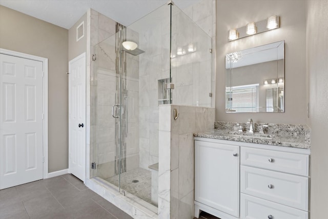 2625 Seashore Dr, Seabrook, TX 77586 - bathroom featuring vanity, a shower stall, and tile patterned flooring