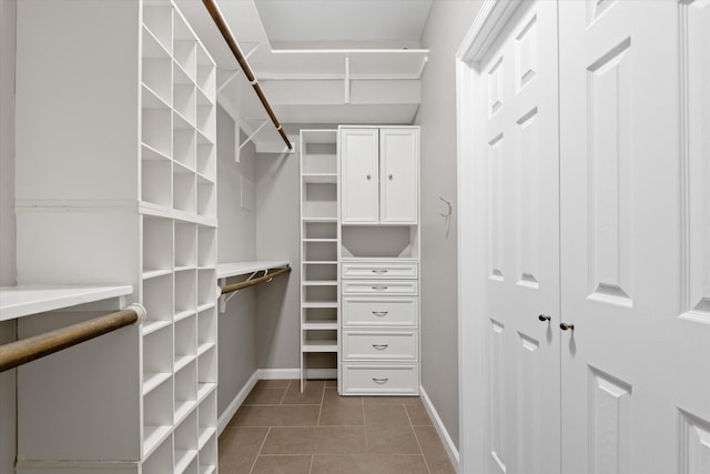 2625 Seashore Dr, Seabrook, TX 77586 - walk in closet with dark tile patterned flooring