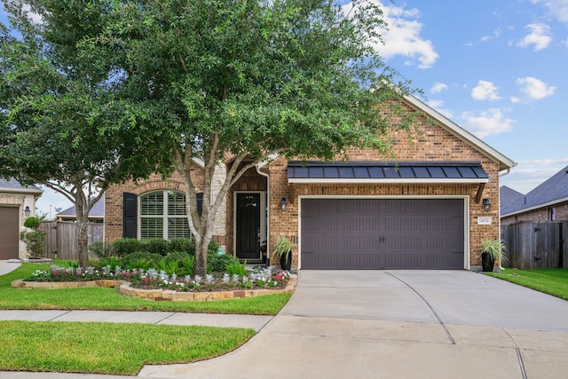 14926 Violet Willow Ct, Cypress, TX 77429 - view of front facade with brick siding, driveway, an attached garage, and a standing seam roof